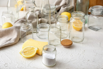 Jars with natural detergents on white background. Ecology concept