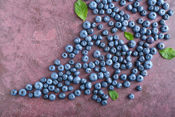 Tasty blueberry on color background