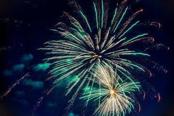 Colorful fireworks on night sky. Explosions of pyrotechnics at festival