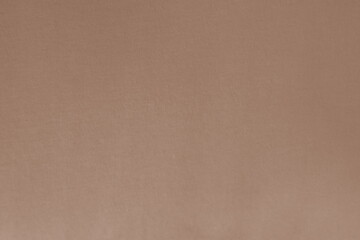 Blurred focus of brown fabric in warm tone for background and decoration