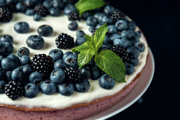 Cottage cheese casserole decorated with blackberry, blueberry and mint leaves.