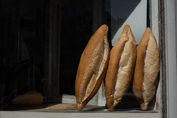 loaves of bread in a window