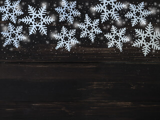 Christmas background on dark wooden board.
