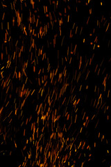 flame of fire with sparks on a black background