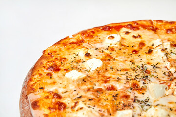Pizza with cheese and herbs on a wooden board. Close-up, selective focus