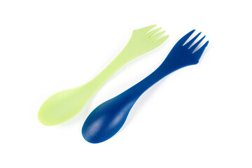 Plastic disposable forks and spoons on a white background
