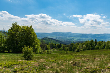 Naklejka na ściany i meble View from meadow bellow Filipka hill summit in springtime Slezske Beskydy mountains in Czech republic