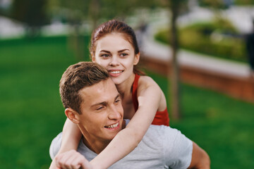 Fototapeta premium woman on back men outdoors walk fun lifestyle