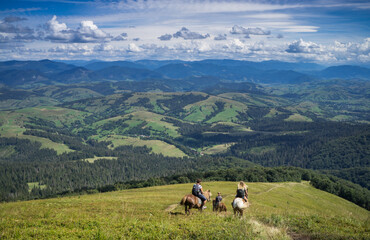 Fototapeta na wymiar Horseback riding in the Carpathian mountains.
