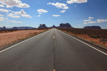 Fototapeta na wymiar View of long road leading towards Monument Valley seen from Forrest Gump Point in Utah, USA