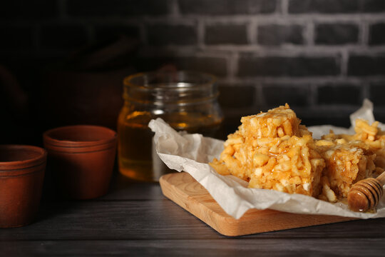 chak chak sweet pastry with honey stands on a dark background