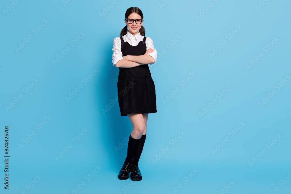 Wall mural Full length body size view of her she nice-looking charming attractive pretty lovely content cheerful schoolgirl nerd geek folded arms isolated over bright vivid shine vibrant blue color background