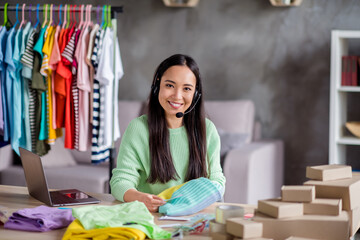 Portrait of her she beautiful cheerful girl operator seamstress sew manager talking on hot help line providing support service order delivering packing things center showroom home-based office