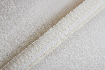 details of clothing, the seam is made on a sewing machine, the sections are processed with threads