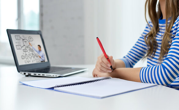 Education, E-learning And School Concept - Close Up Of Student Girl With Exercise Book, Pen And Teacher On Laptop Computer Having Online Lesson At Home