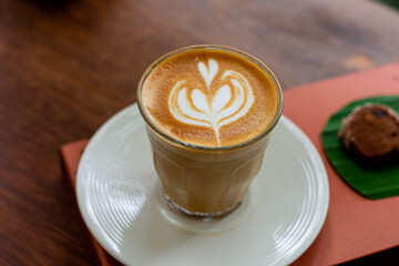 coffee latte art on table in coffee shop.Close-up