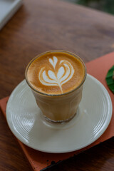 coffee latte art on table in coffee shop.Close-up
