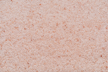 Himalayan pink salt granules macro shot background