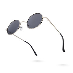 Round gray gun metal sunglasses isolated on white