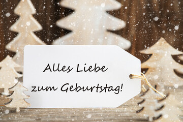 Fototapeta na wymiar Label With German Text Alles Liebe Zum Geburtstag Means Happy Birthday. White Wooden Christmas Tree As Decoration. Brown Wooden Background With Snow