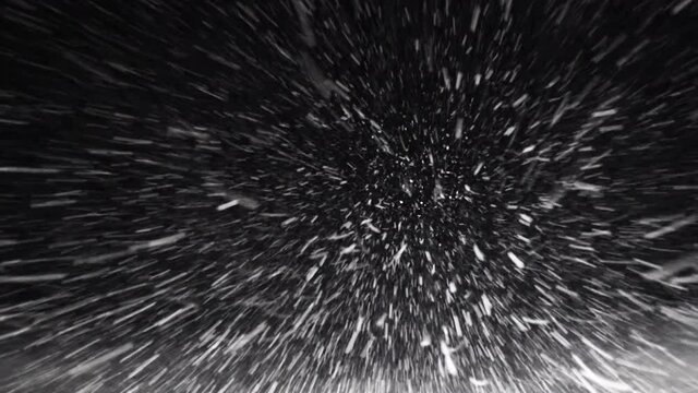A Car Driving Down the Highway Through Snow and Blizzard Looking Through the Windshield Falling Snow Night Road Snowflakes Winter Storm