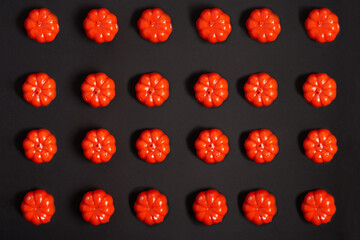 Halloween background, orange decorative plastic pumpkin black cardboard Thanksgiving greeting card