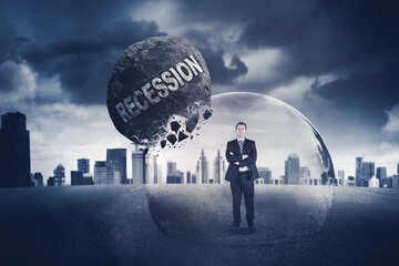 Male manager crossed arms in protective bubble