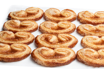Obraz na płótnie Canvas Flaky pastry hearts glazed with caramelized sugar