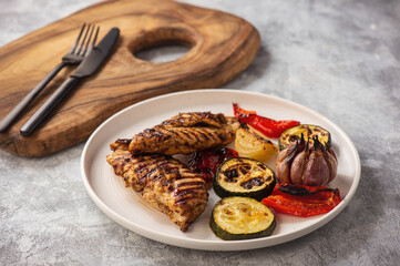 Grilled chicken breasts and vegetables.