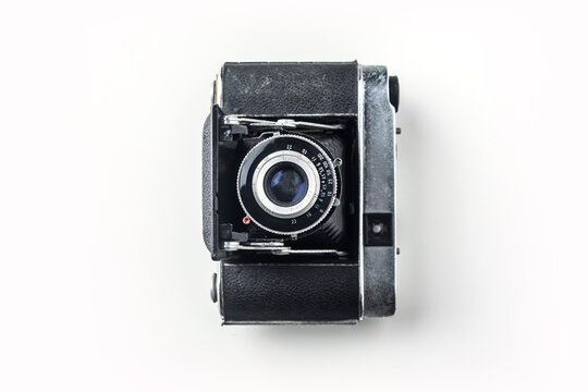 Top view of vintage cameras on white background