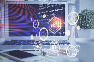 Multi exposure of desktop computer and technology theme hologram. Concept of software development.