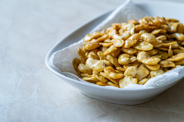 Homemade Fried Salty Roasted Fava Broad Beans Chips. Healthy Organic Snacks. Portuguese Style with Garlic.