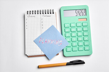 calculator notepad on a white background. Budget