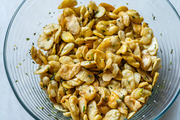 Homemade Fried Salty Roasted Fava Broad Beans Chips. Healthy Organic Snacks. Portuguese Style with Garlic.