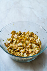 Homemade Fried Salty Roasted Fava Broad Beans Chips. Healthy Organic Snacks. Portuguese Style with Garlic.