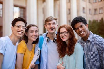 Joyful Multiethnic Students Posing Smiling To Camera Standing Outside College