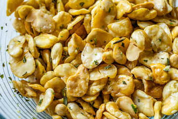 Homemade Fried Salty Roasted Fava Broad Beans Chips. Healthy Organic Snacks. Portuguese Style with Garlic.