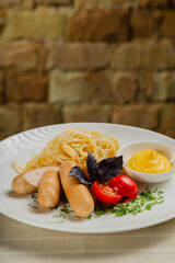 Fresh sausages with pasta and cheese sauce.
