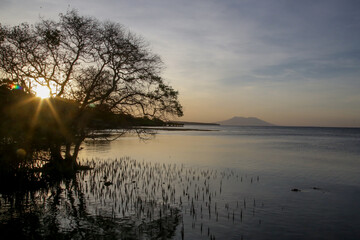 Beautiful sunset over ocean with volcano view