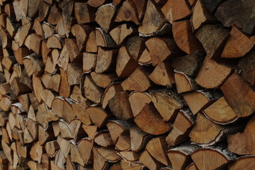 background macro image of round logs of brown color for a fireplace