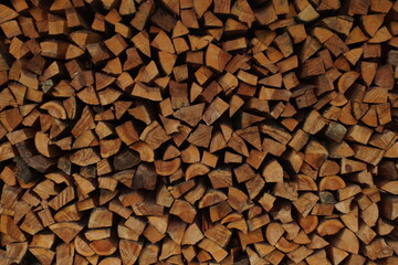 background macro image of round logs of brown color for a fireplace
