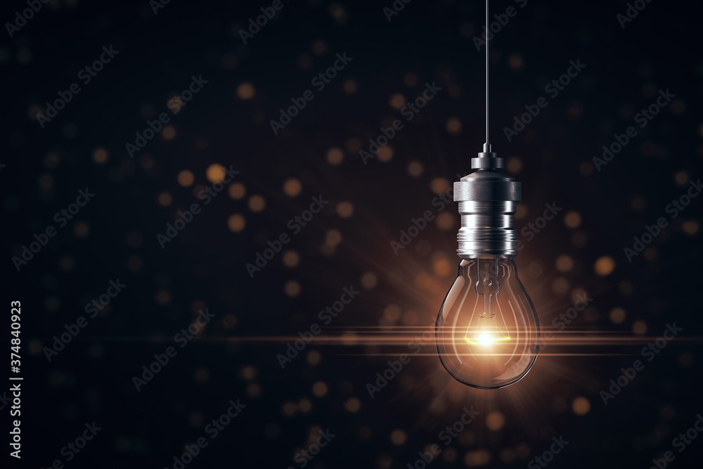 Wall mural creative glowing light bulb on gray background.