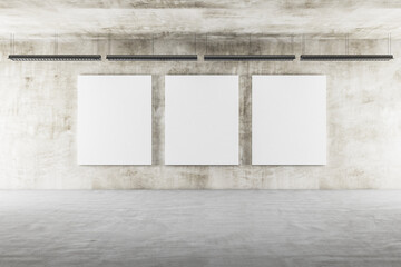 Exhibition interior with ceiling lamp and three blank banners