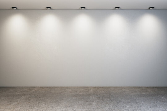 Glowing backdrop with spotlight and blank wall.