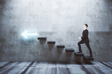 Businessman walking on stairs to success
