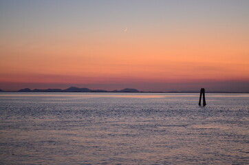 Fototapeta na wymiar red sunset on the Venetian lagoon