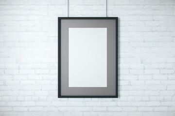 Blank poster on brick wall.