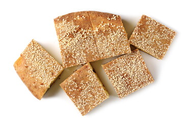 Cornbread slices with sesame seeds, traditional breakfast pastry isolated on white background, top view