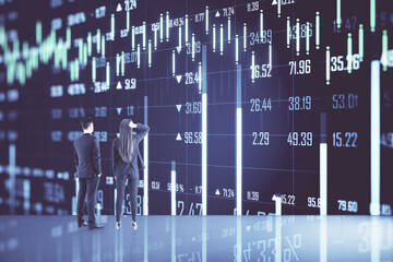 Businesspeople looking creative stock chart and financial analytics hologram