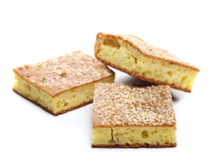 Cornbread slices with sesame seeds, traditional breakfast pastry isolated on white background